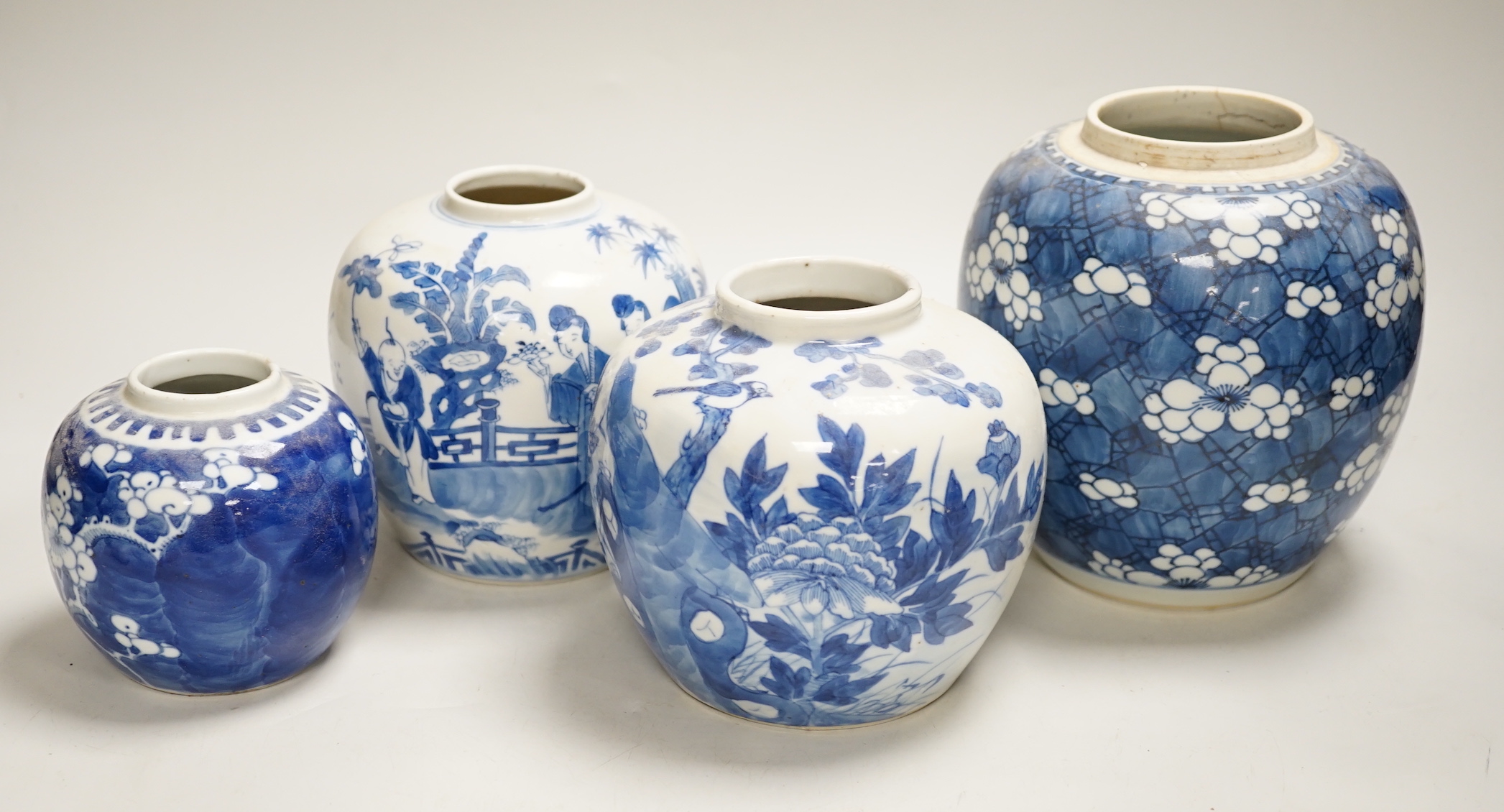 An 18th century Chinese blue and white Prunus jar and three 19th century Chinese blue and white jars, tallest 16cm